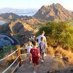 Visitors trekking along the Padar Island hillside trail