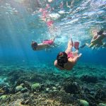 Snorkeling above a colorful coral reef at Manjarite Island